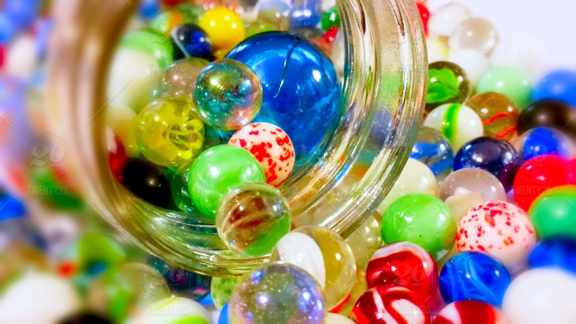 stock-photo-colorful-game-jar-bright-and-bold-jar-of-marbles-65a7fa5b-3cfa-40d0-8ed9-ca2d343cad84